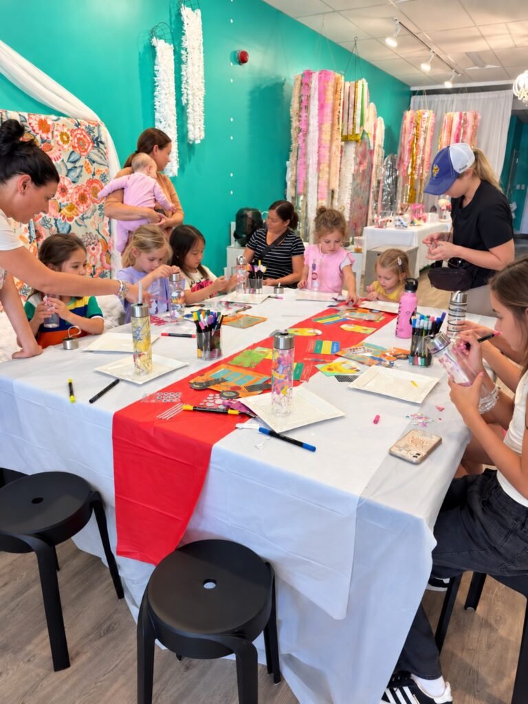 Families creating art together at Posh & Pearl Studio